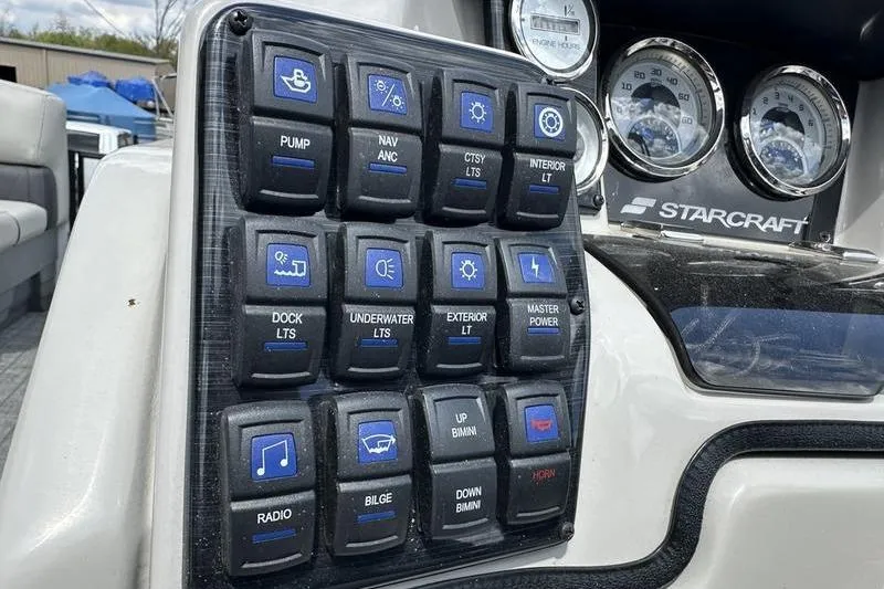Slide: The Image of Control panel of a 2022 Starcraft SLS 3 boat with labeled switches and gauges. - 10
