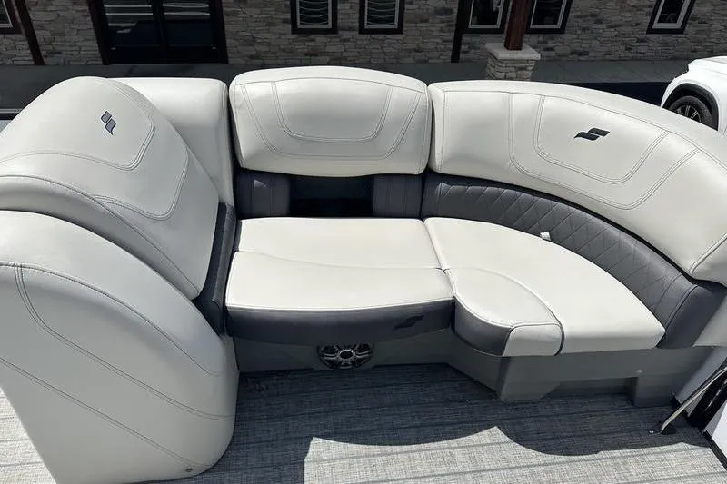 Slide: The Image of Luxurious seating on 2022 Starcraft SLS 3 boat, featuring elegant white and gray upholstery. - 11