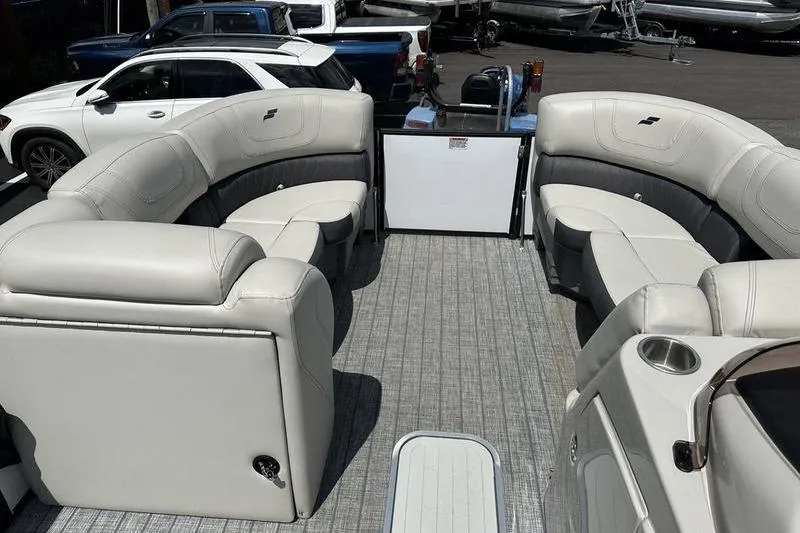 Slide: The Image of Interior of 2022 Starcraft SLS 3 pontoon boat with plush seating and modern design. - 12