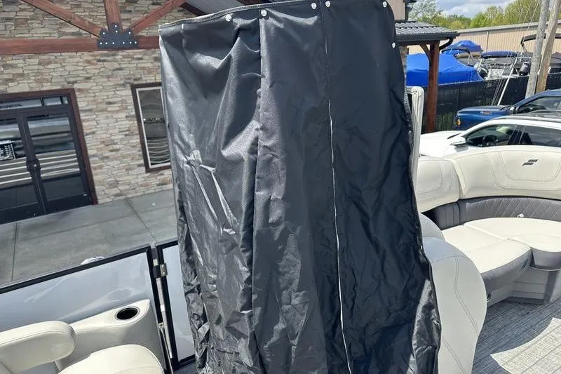 Slide: The Image of 2022 Starcraft SLS 3 boat interior with black privacy curtain. - 14