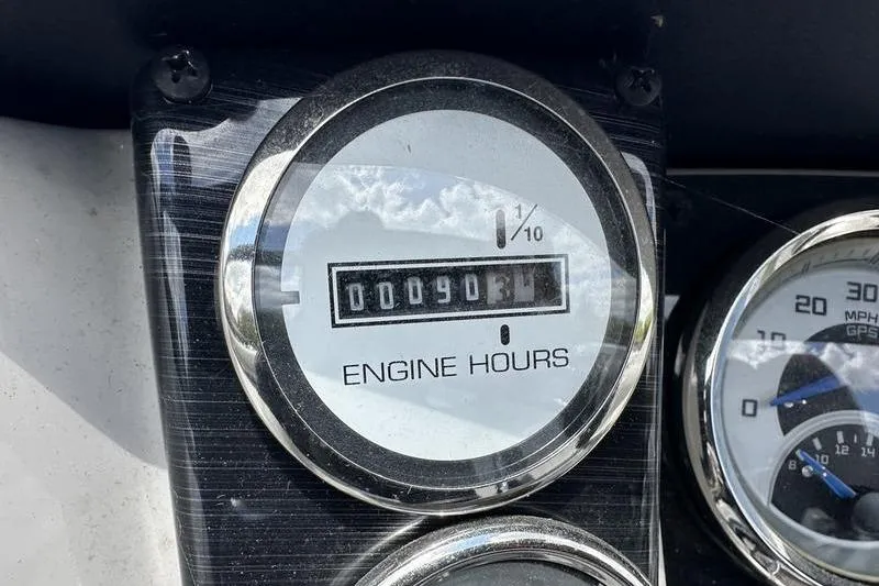 Slide: The Image of Engine hour meter showing 90.6 hours on a 2022 Starcraft SLS 3 boat. - 16
