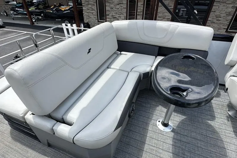 Slide: The Image of 2022 Starcraft SLS 3 boat interior with gray seating and round table. - 22