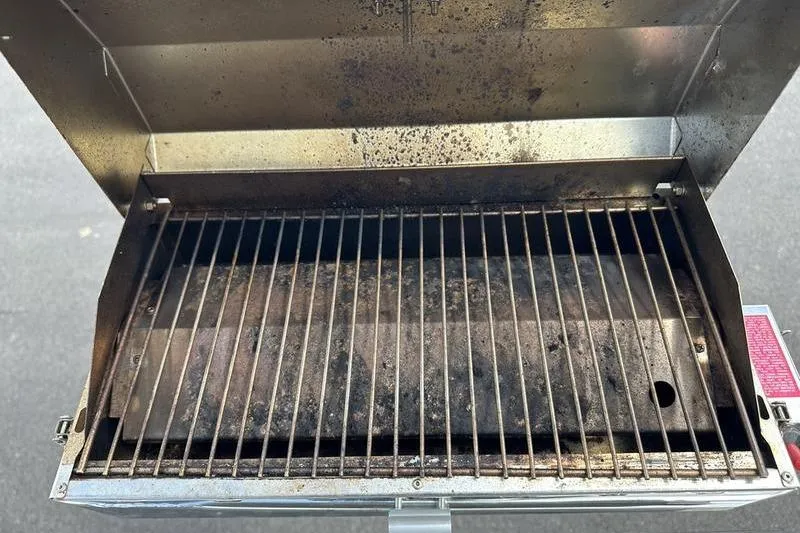 Slide: The Image of Empty Starcraft SLS 3 grill with open lid, showing metal grates, 2022 model. - 25
