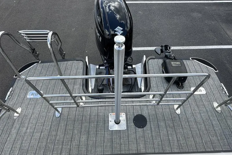 Slide: The Image of 2022 Starcraft SLS 3 boat deck with motor and railing, viewed from above. - 26
