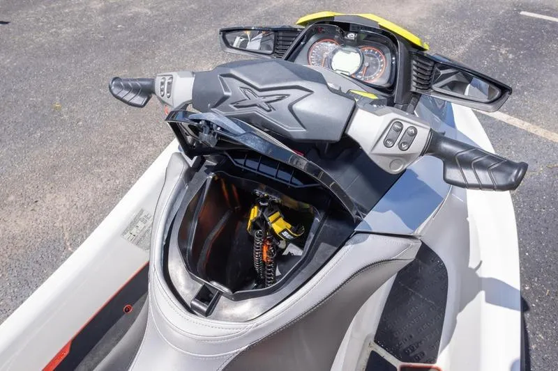 Slide: The Image of 2016 Sea Doo RXT 300 jet ski dashboard and storage compartment. - 6