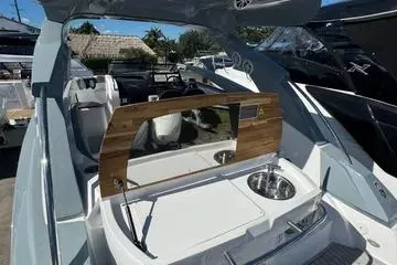 Slide: The Image of 2025 NX Boats NX280 XTREME luxury yacht interior with sleek design and modern amenities. - 10