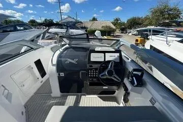 Slide: The Image of 2025 NX Boats NX280 XTREME cockpit with modern controls and sleek design. - 5