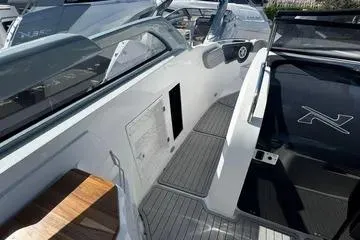 Slide: The Image of 2025 NX Boats NX280 XTREME interior with sleek design and modern features. - 9