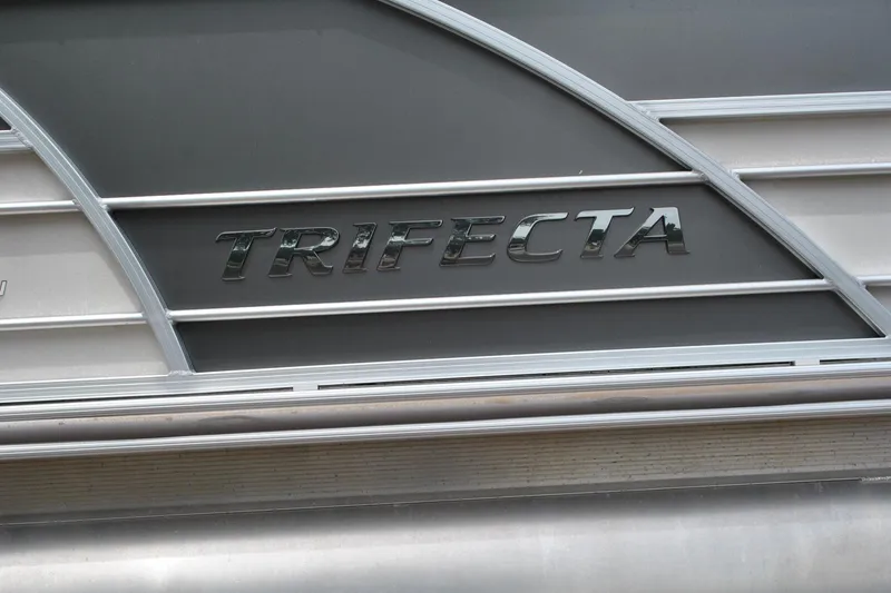 Slide: The Image of 2018 Trifecta 2.75 boat logo on metallic surface. - 10