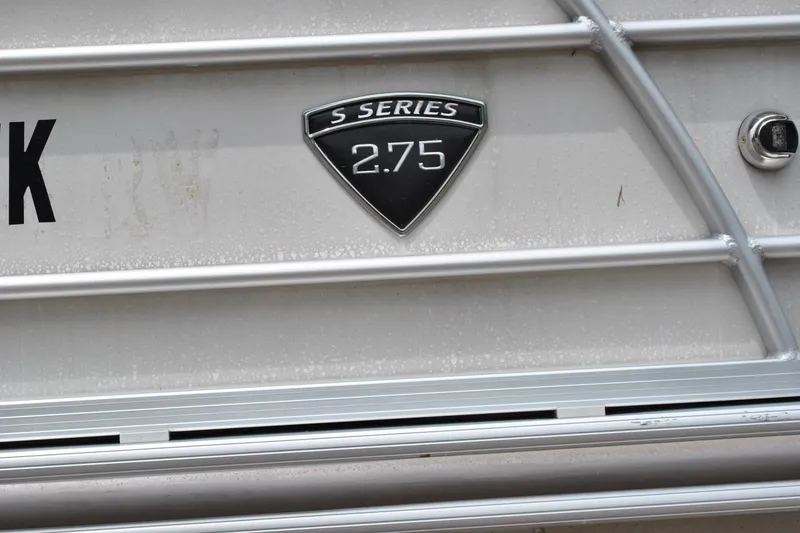 Slide: The Image of Close-up of 2018 Trifecta 2.75 S Series boat emblem on metallic surface. - 11