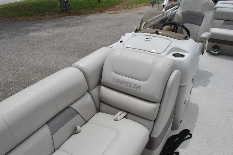 Slide: The Image of 2018 Trifecta 2.75 boat interior with plush seating and steering console. - 14