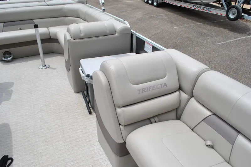 Slide: The Image of Luxurious seating on a 2018 Trifecta 2.75 pontoon boat, featuring plush beige upholstery. - 15