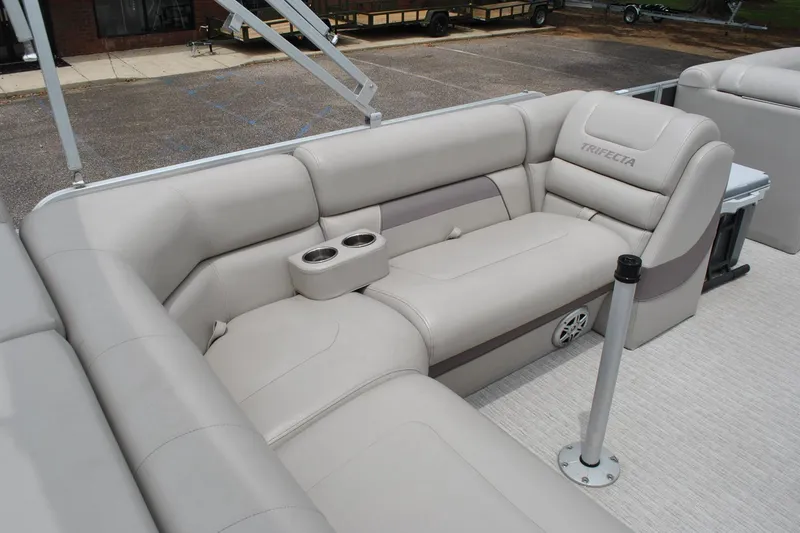 Slide: The Image of Luxurious seating on a 2018 Trifecta 2.75 pontoon boat with cup holders and speaker. - 18