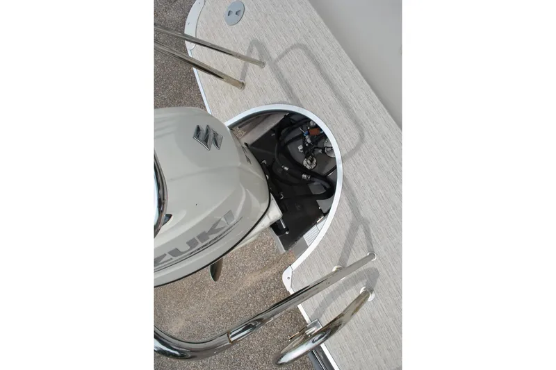 Slide: The Image of Top view of a 2018 Trifecta 2.75 boat engine and deck area. - 20