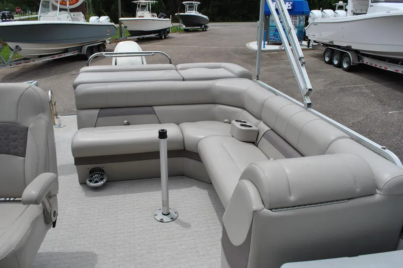 Slide: The Image of Luxurious seating on a 2018 Trifecta 2.75 pontoon boat, featuring plush gray upholstery. - 21