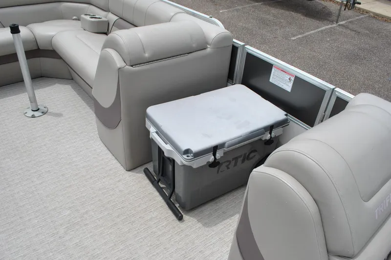 Slide: The Image of Interior of 2018 Trifecta 2.75 pontoon boat with seating and cooler. - 22
