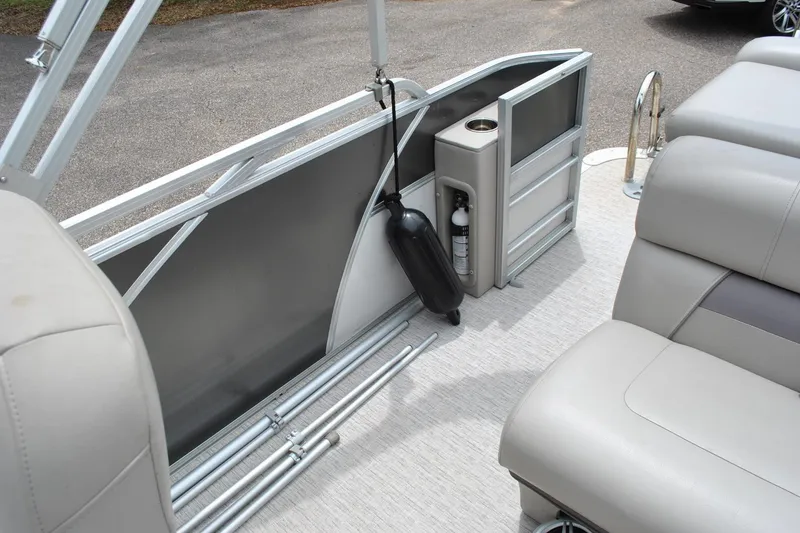 Slide: The Image of Interior of a 2018 Trifecta 2.75 pontoon boat with seating and safety equipment. - 23
