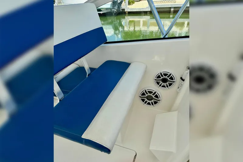 Slide: The Image of Blue and white seating on 2006 Luhrs 28 Open boat with speakers visible. - 10