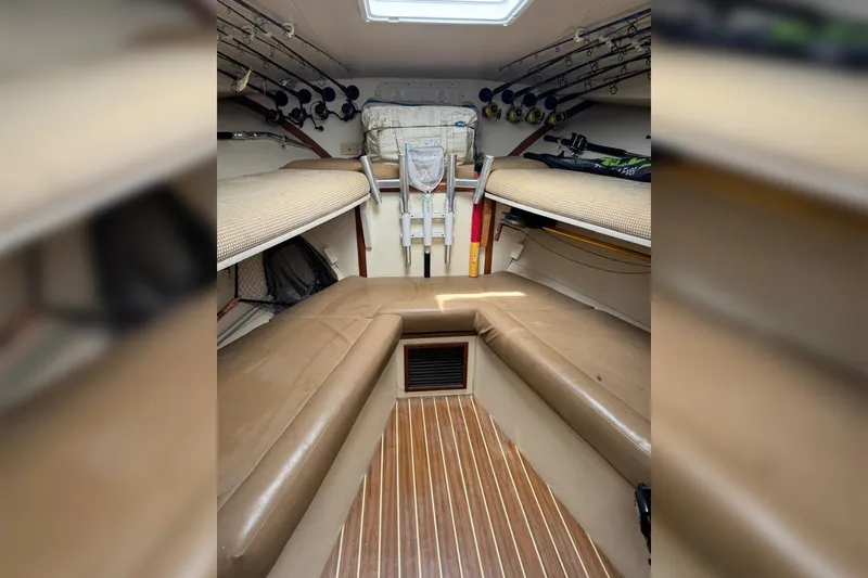 Slide: The Image of Interior of 2006 Luhrs 28 Open boat with fishing rods and seating. - 15