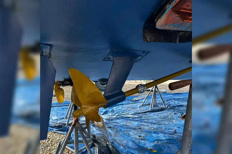 Slide: The Image of 2006 Luhrs 28 Open boat propeller and shaft on stands, under maintenance. - 4