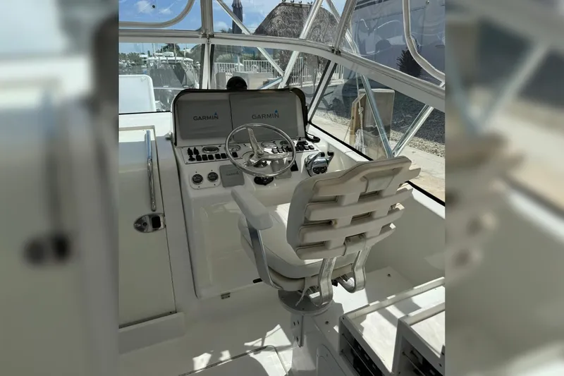 Slide: The Image of Helm of 2006 Luhrs 28 Open boat with Garmin navigation system. - 7