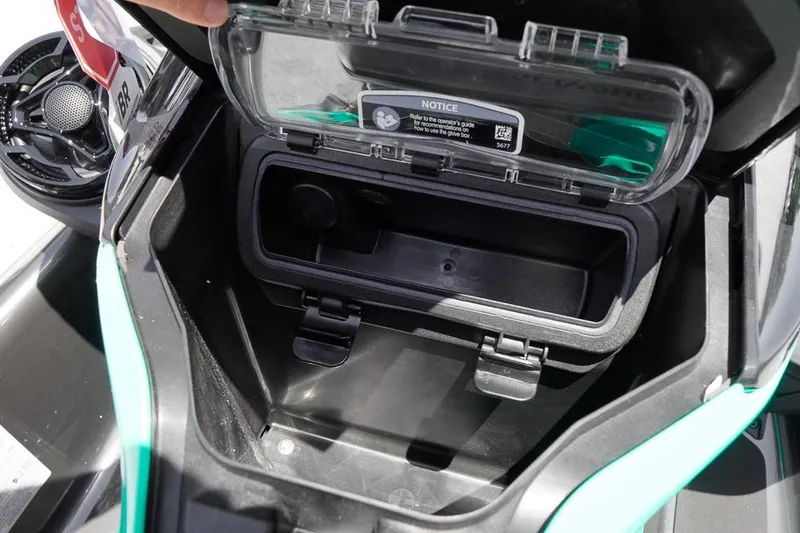 Slide: The Image of 2026 Sea-Doo GTI SE 130 storage compartment with open lid, showcasing interior space. - 10