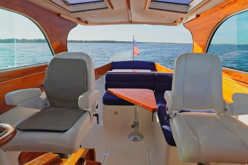 Slide: The Image of Interior of 2004 Hinckley Picnic Boat 36 EP with elegant seating and scenic water view. - 18