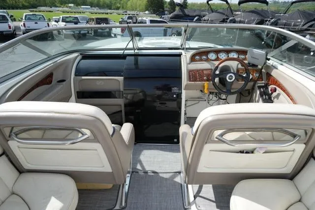 Slide: The Image of Interior view of a 2002 Cobalt 263 boat, featuring a sleek dashboard and comfortable seating. - 10
