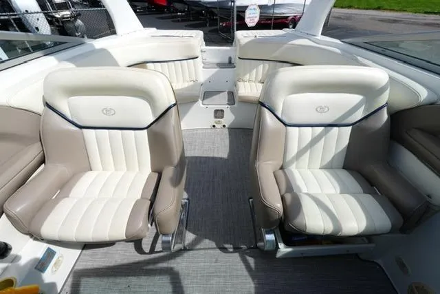 Slide: The Image of Interior of a 2002 Cobalt 263 boat with beige and white seating. - 13