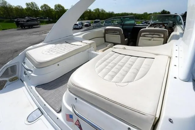 Slide: The Image of 2002 Cobalt 263 boat with spacious white leather seating and sleek design. - 15