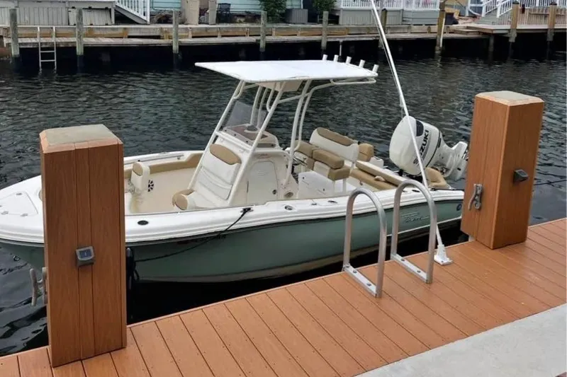 The Image of 2018 Pioneer 202 Islander boat docked by wooden pier. - 0