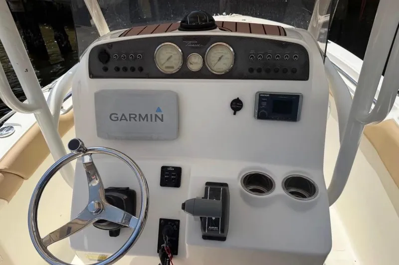 Slide: The Image of 2018 Pioneer 202 Islander boat dashboard with Garmin navigation system and steering wheel. - 4