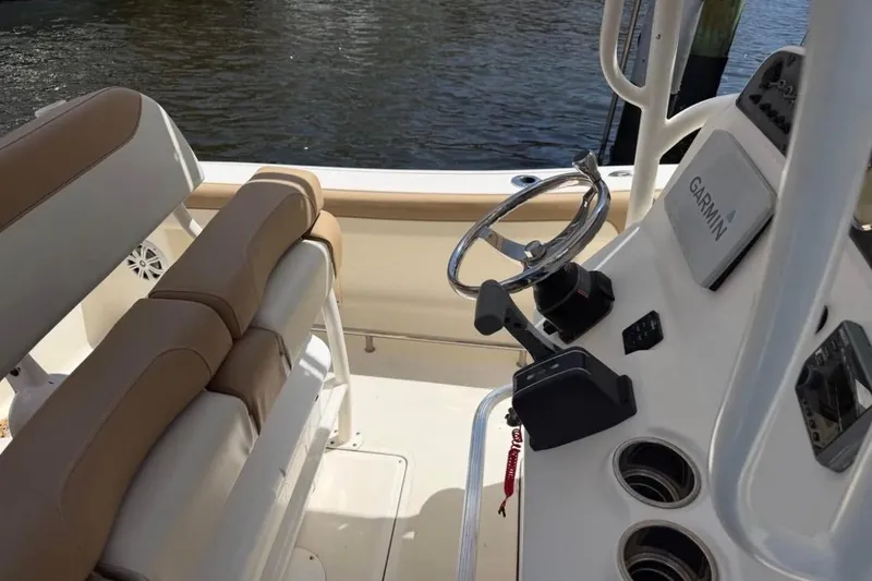Slide: The Image of 2018 Pioneer 202 Islander boat cockpit with Garmin navigation system and comfortable seating. - 5