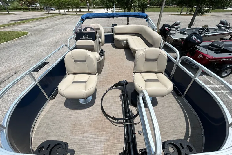 Slide: The Image of 2020 Sun Tracker Bass Buggy 16 DLX pontoon boat with beige seating and spacious deck. - 5