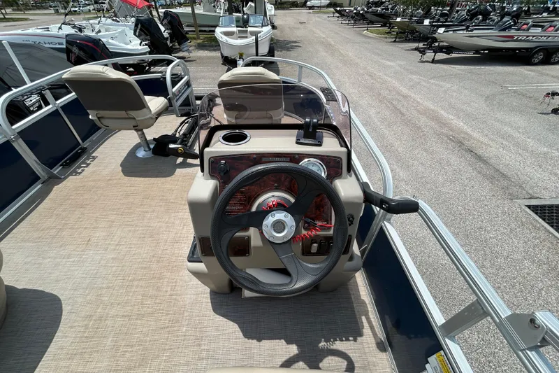 Slide: The Image of 2020 Sun Tracker Bass Buggy 16 DLX pontoon boat interior with steering console. - 8