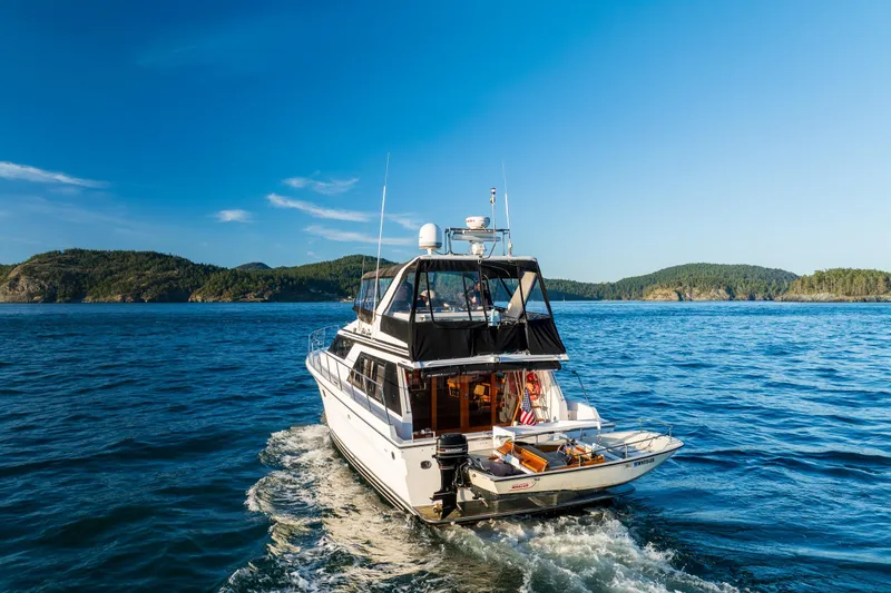 Slide: The Image of Ocean Alexander 48 Sedan yacht cruising on blue waters, 1990 model. - 10