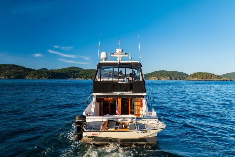 Slide: The Image of Ocean Alexander 48 Sedan yacht cruising on blue waters, 1990 model. - 11