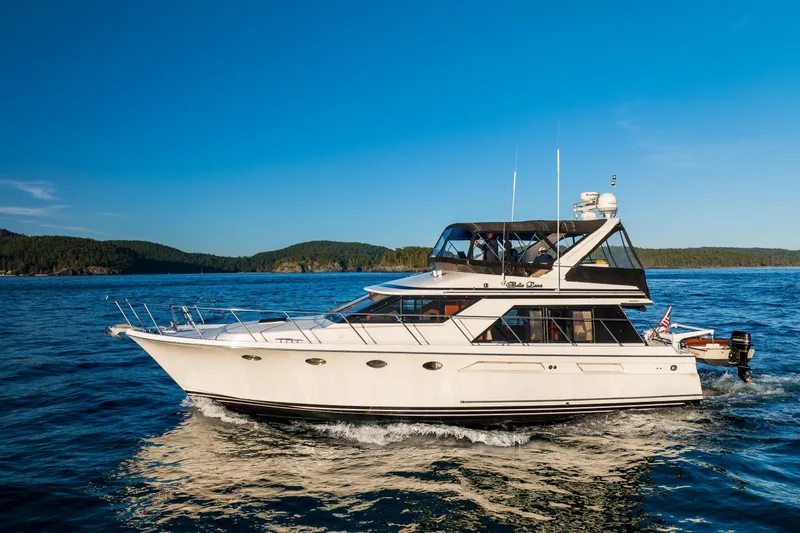Slide: The Image of Ocean Alexander 48 Sedan yacht cruising on a sunny day, 1990 model. - 2