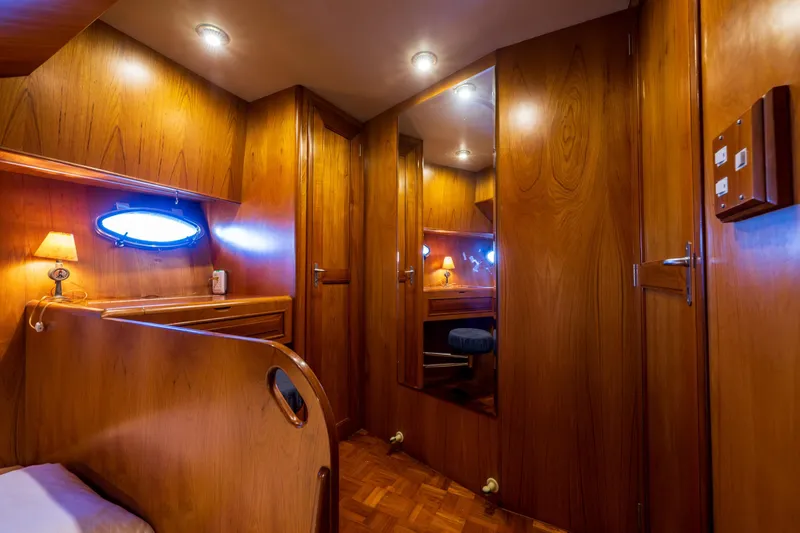 Slide: The Image of Luxurious wooden interior of 1990 Ocean Alexander 48 Sedan yacht cabin. - 21