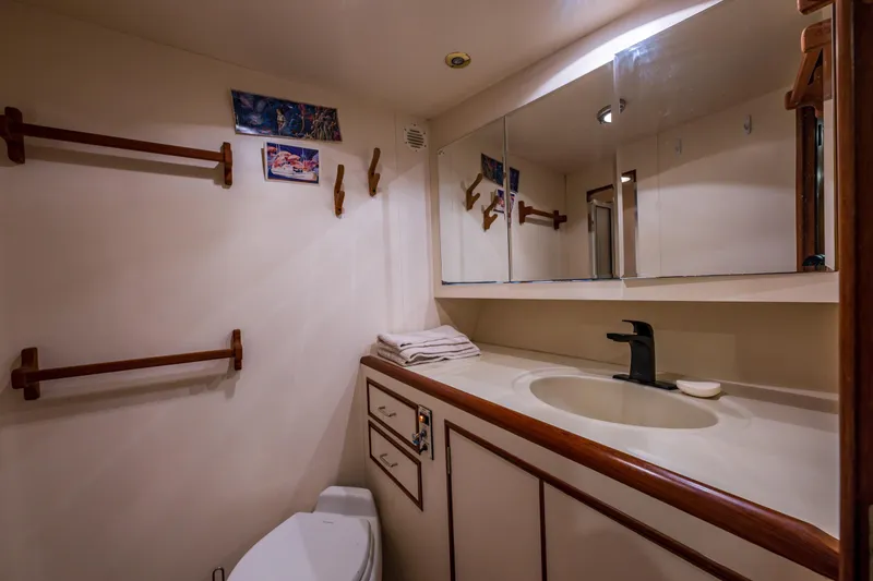 Slide: The Image of Bathroom interior of 1990 Ocean Alexander 48 Sedan yacht with sink and mirror. - 22