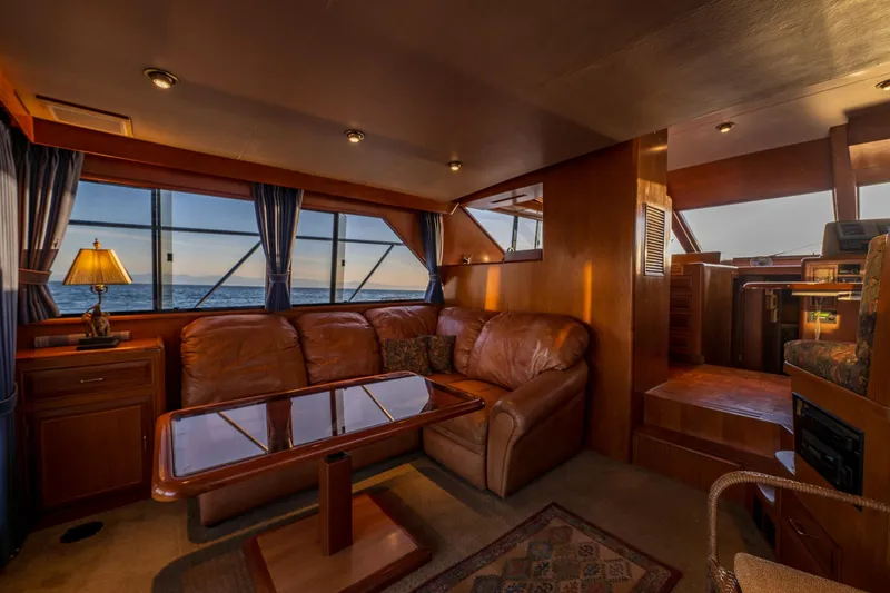 Slide: The Image of Luxurious interior of 1990 Ocean Alexander 48 Sedan yacht with leather seating and ocean view. - 23