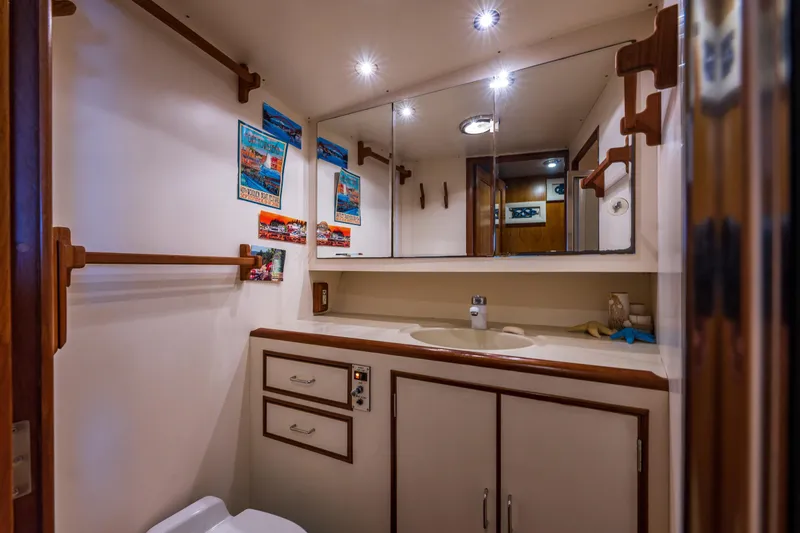 Slide: The Image of Bathroom interior of 1990 Ocean Alexander 48 Sedan yacht with mirror and sink. - 26
