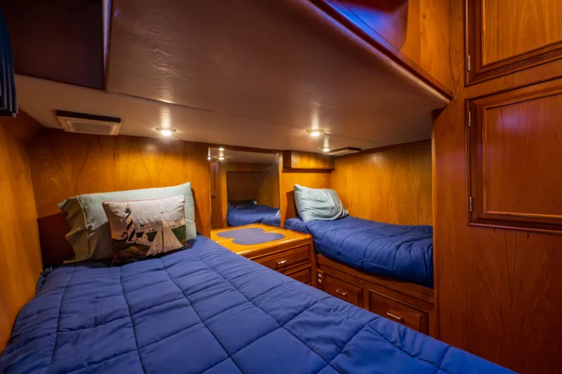 Slide: The Image of Cozy twin cabin in 1990 Ocean Alexander 48 Sedan yacht with wooden interior. - 29
