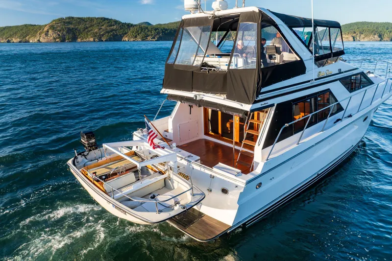 Slide: The Image of 1990 Ocean Alexander 48 Sedan yacht cruising on scenic blue waters. - 3