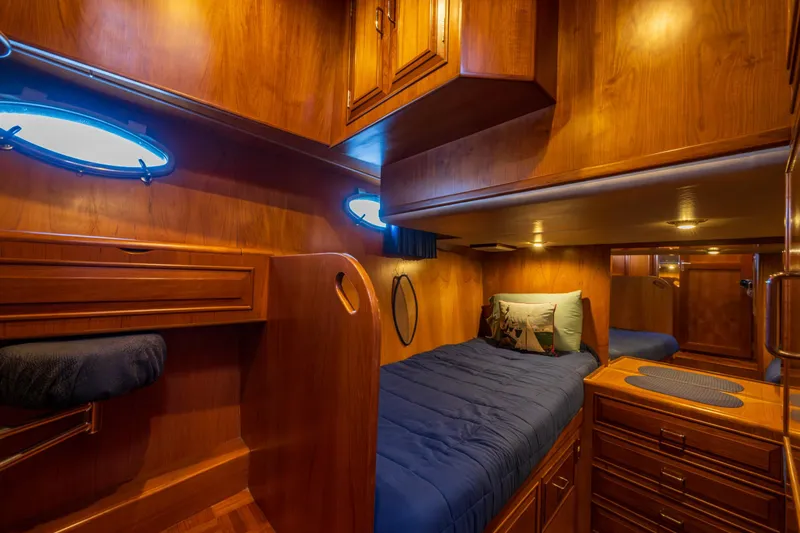 Slide: The Image of Luxurious wooden cabin interior of 1990 Ocean Alexander 48 Sedan yacht. - 30