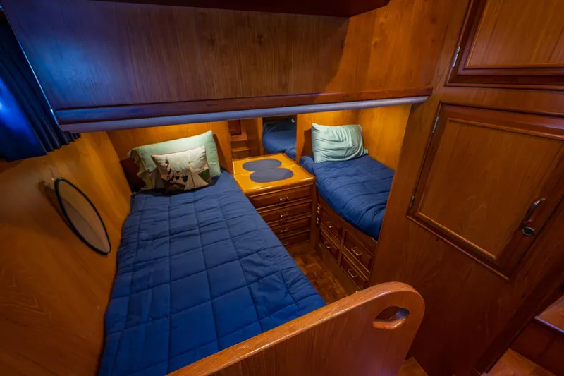 Slide: The Image of Cozy twin cabin with wooden interior on 1990 Ocean Alexander 48 Sedan yacht. - 31