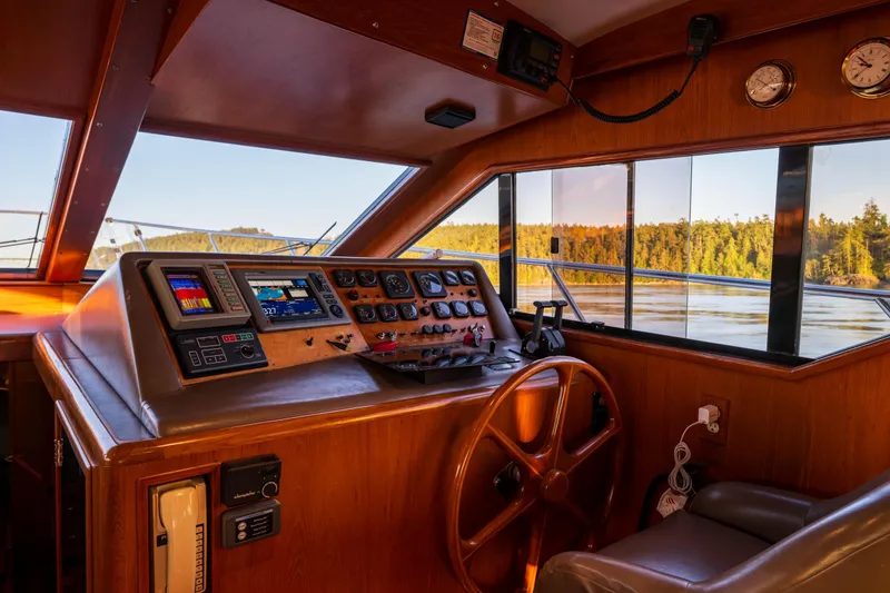 Slide: The Image of Cockpit of 1990 Ocean Alexander 48 Sedan yacht with navigation instruments and scenic view. - 34