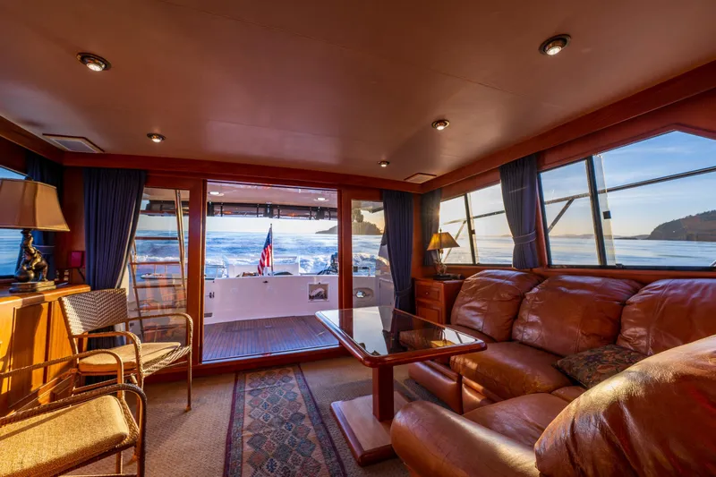 Slide: The Image of Luxurious interior of 1990 Ocean Alexander 48 Sedan yacht with ocean view. - 36