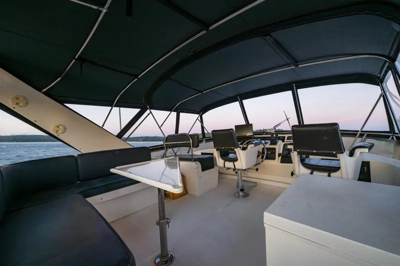 Slide: The Image of Interior view of 1990 Ocean Alexander 48 Sedan yacht with seating and helm. - 48
