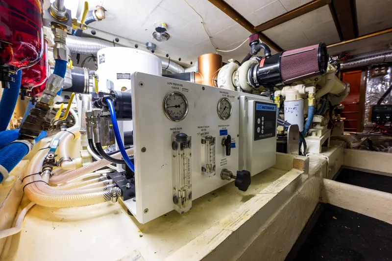 Slide: The Image of Engine room of 1990 Ocean Alexander 48 Sedan yacht with watermaker system. - 50